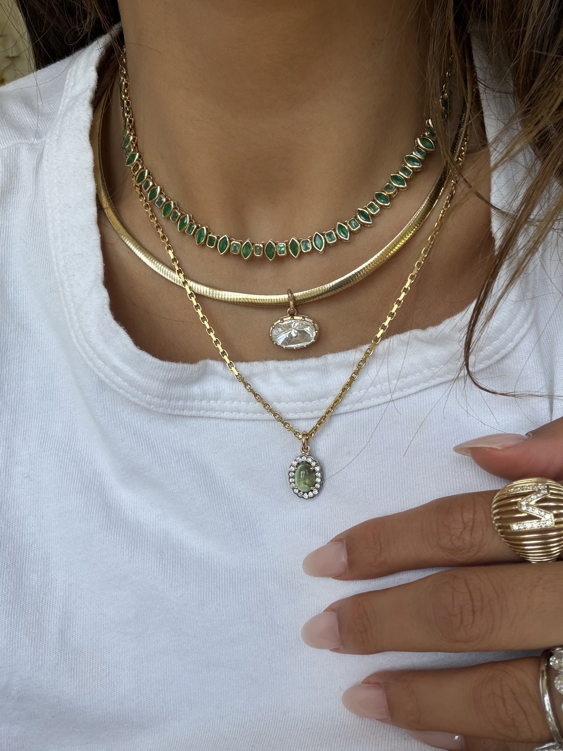 DUNIYA necklaces worn together
